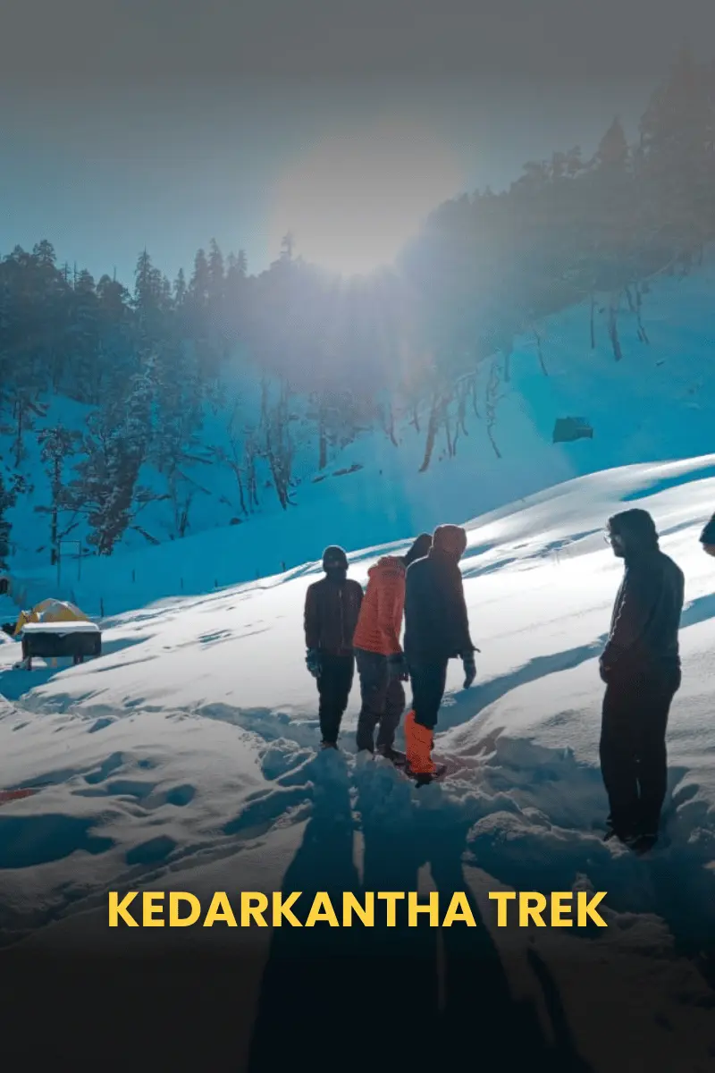 Kedarkantha trek trail covered in snow with stunning Himalayan views.