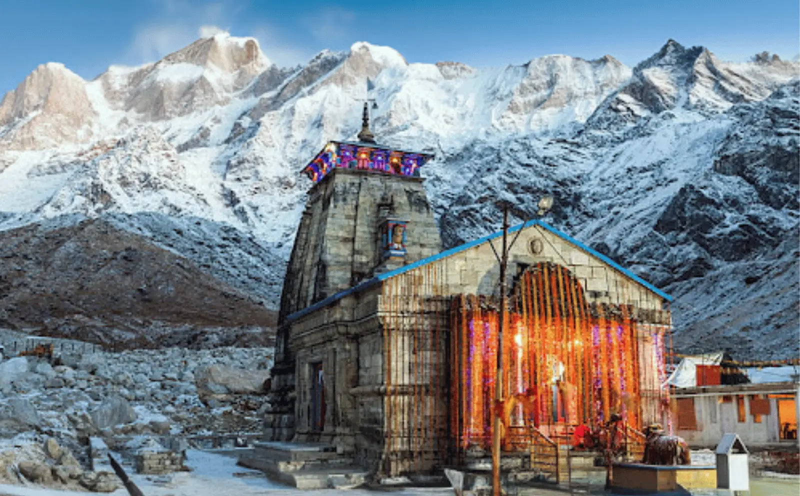Kedarnath Temple in Uttarakhand, with snow-capped mountains in the background.